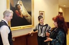 Sister Mary Christi, I.H.M., and Alexa Bucci chat with Diana Tavani, volunteer coordinator at St. Monica Manor, Philadelphia. (Sarah Webb)