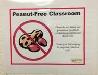 Signs like this one declaring a classroom "peanut-free" are becoming increasingly common as schools deal with a growing number of students with food allergies. (Brian Smith | MLive.com)
