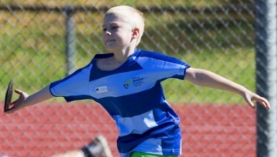 Asher Hovell tries his hand at discus at the Halberg Junior Disability Games.