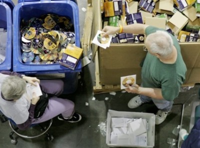 Developmentally disabled employees sort compact discs in Seattle under a contract between Northwest Center and GreenDisk. (Ken Lambert/The Seattle Times)