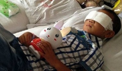 กั๊วะ บิน เด็กชายชาวจีนวัย 6 ขวบ นอนพักรักษาตัวอยู่ที่โรงพยาบาล