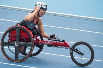 Wheelchair racer and B.C. politician Michelle Stilwell celebrates as she wins gold in Saturday's 400-metre race at the Paralympic Games in Brazil.